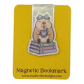 A cute cartoon beaver holding a bubble tea on a stack of books, mounted on a yellow magnetic bookmark card with the text 'Magnetic Bookmark' and 'www.studiovidesigns.