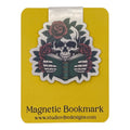 A yellow magnetic bookmark card featuring a die-cut sticker of a skull reading a book, surrounded by red roses and green leaves. The card has a white tab at the top and black text at the bottom that reads 'Magnetic Bookmark' and 'www.