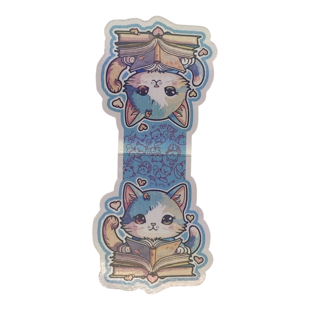 A magnetic bookmark featuring two cute illustrated cats reading books, arranged vertically with a blue patterned center and pastel accents on a plain white background.