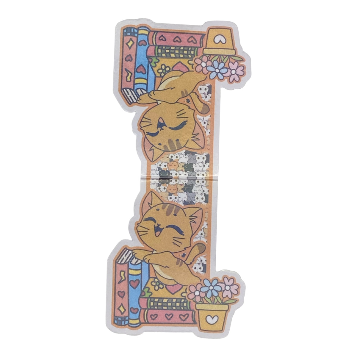 A cute magnetic bookmark featuring a cute cartoon design with two orange tabby cats, books, flowers, and a small potted plant on a white background.