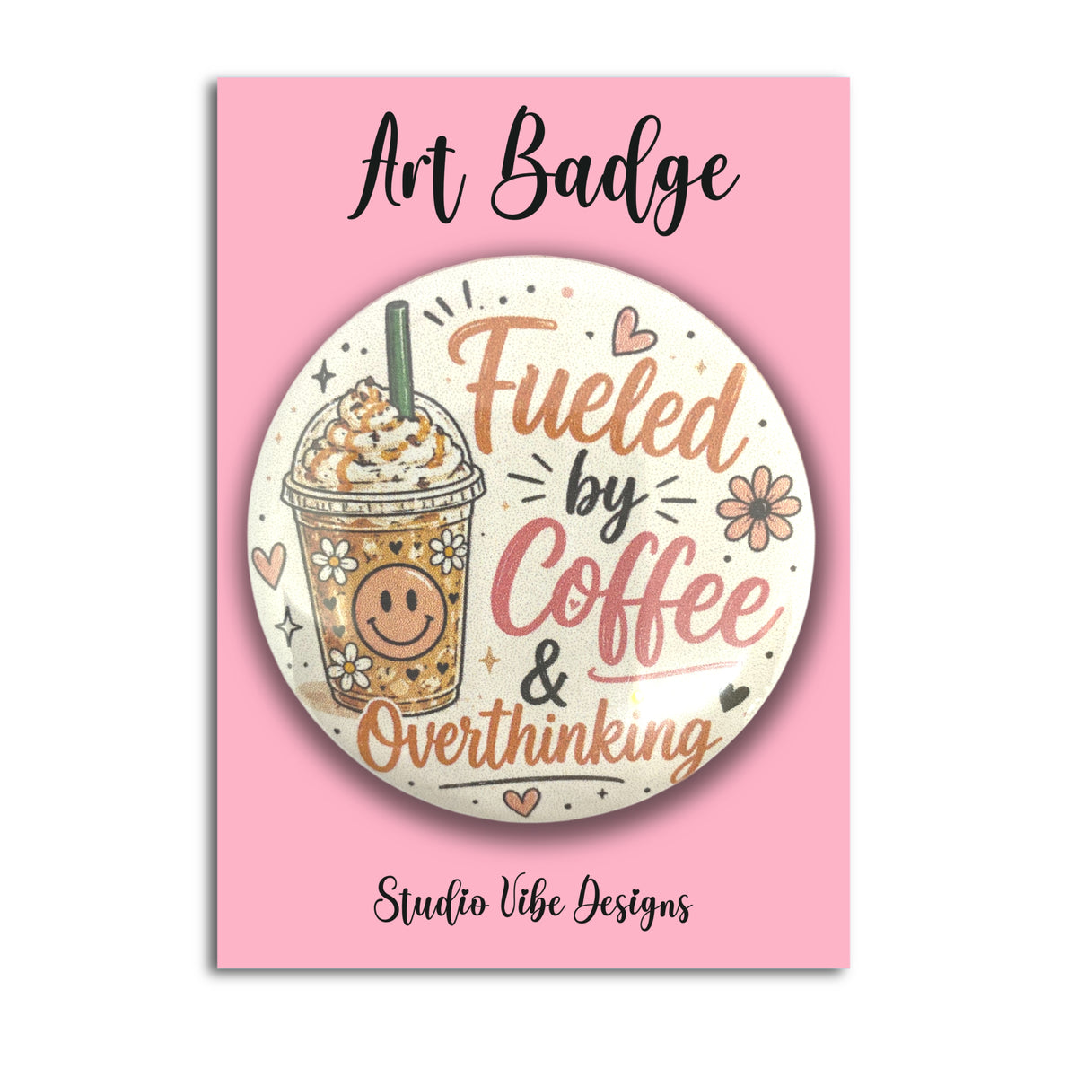 A circular art badge featuring a coffee cup illustration and the phrase 'Fueled by Coffee & Overthinking' on a pink backing card labeled 'Art Badge' and 'Studio Vibe Designs'.